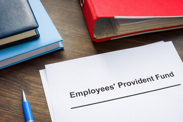 Documents about Employees Provident Fund and red folder.