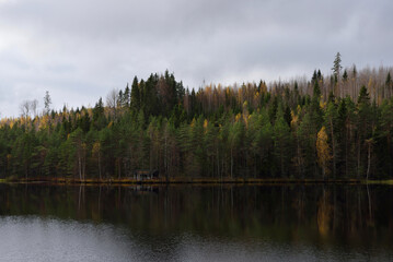 Fototapeta na wymiar Lake with reflections in Finland.Autumn landscape.