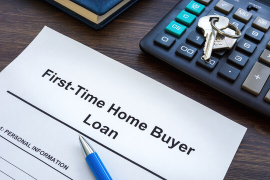 First time home buyer loan application and key.