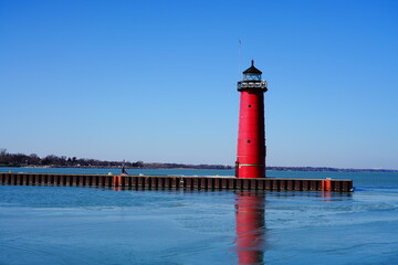 Kenosha North Pier lighthouse standing during the cold Winter Season of February out in Kenosha,...