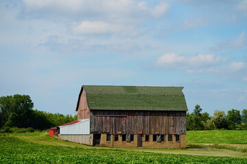 An old abandoned farm barn sits in the countryside