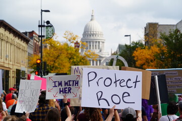 Rear view of members and supporters of Pro-Choice and Bans Off Our Bodies rallied together and marched to the Madison state capitol. - obrazy, fototapety, plakaty