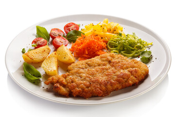 Pork chop, baked potatoes and vegetable salad