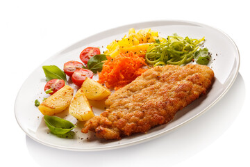 Pork chop, baked potatoes and vegetable salad