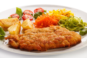 Pork chop, baked potatoes and vegetable salad