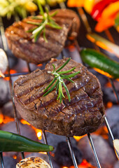 Delicious beef meat with vegetable on a barbecue grill.