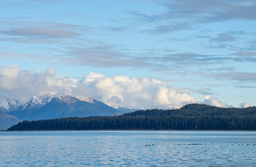 Snow dusted mountains by the sea in Southeast Alaska
