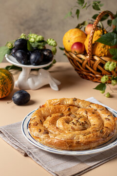 Bakery Vertuta Spiral Pie With Pumpkin On Table With Autumn Decor