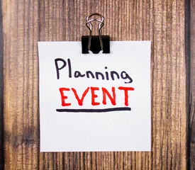 Planning event - text concept on a piece of paper on the table. The concept of planning a meeting...