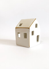 Obraz na płótnie Canvas House decoration. Mini ceramic house object isolated. Porcelain miniature house. Real estate business. 