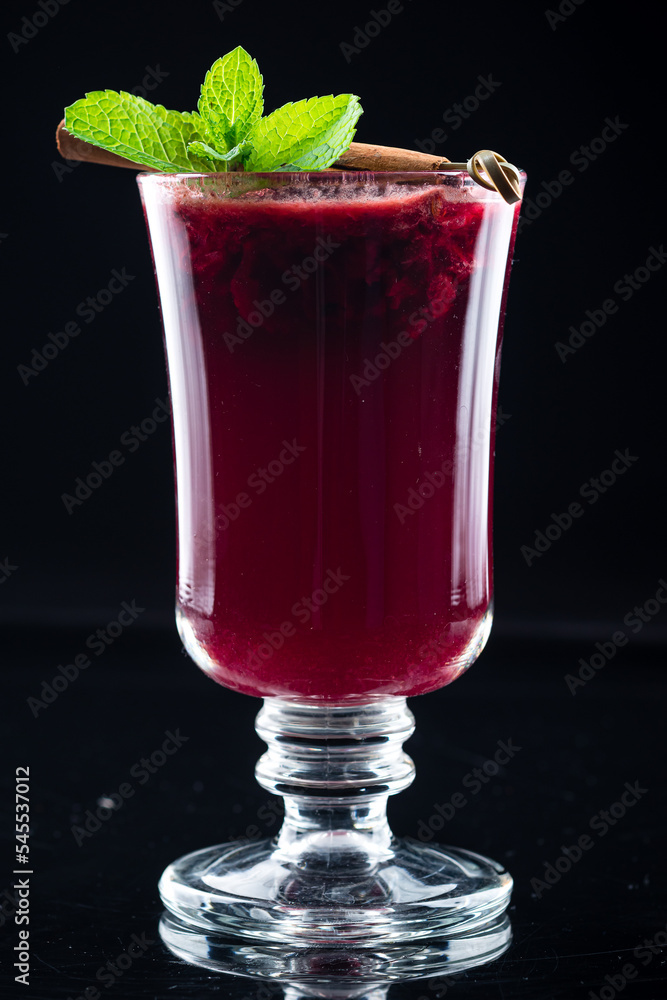 Poster Summer raspberry tea with mint, cinnamon and spices in a glass. Cup of hot tea with raspberry