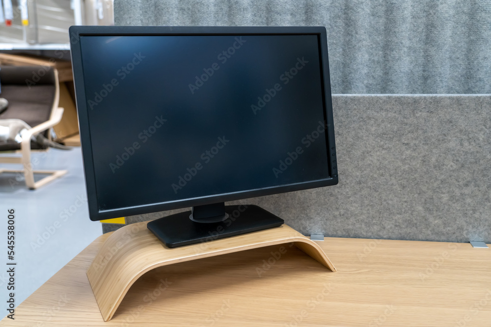 Poster minimal workspace with computer with blank screen on wooden table in living room
