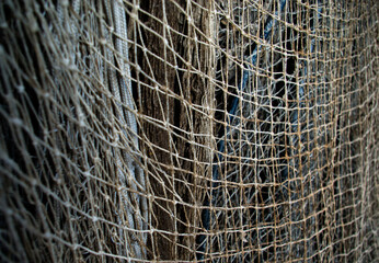 Old, used fishing net hanging