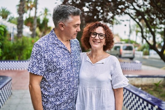 Middle Age Hispanic Couple Together Outdoors On Summer Day