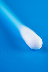 Close up of blue cotton swabs on blue background