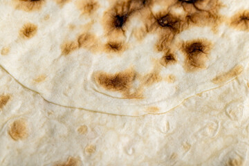 Wheat pita bread with dark spots
