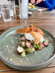 croissant with salmon in a cafe
