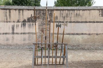 exhibitor with several medieval spears, halberds and swords. historical recreations
