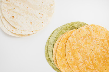 Spanish tomato, spinach flavored and plain wheat tortilla wraps on