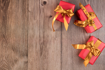 Three christmas gifts on wooden background