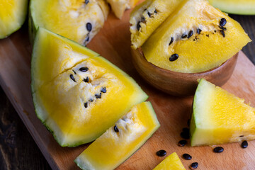 Ripe and juicy yellow watermelon cut into pieces