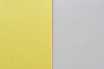 yellow construction and beige-gray paper background