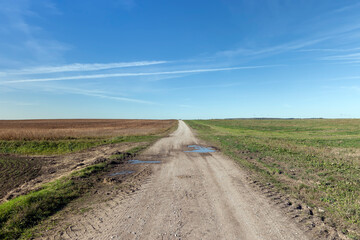 Fototapeta na wymiar A country road without asphalt or gravel
