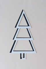 gray and black shadow holiday tree on blank paper