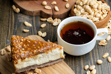 Cheesecake made of dairy products and peanuts in caramel