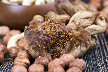 Dried figs on a black wooden table