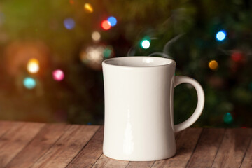 Hot Holiday drink on wood board with sparkling background
