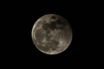 A close-up photo of the moon at night.