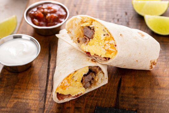 Breakfast burrito with sausage, eggs, hashbrown and cheese