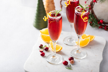 Christmas mimosa with cranberry juice and orange