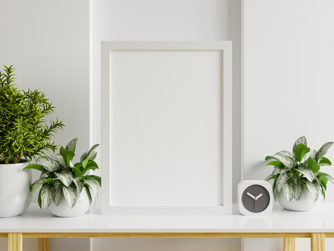 Interior poster mockup with vertical white frame in home interior background.
