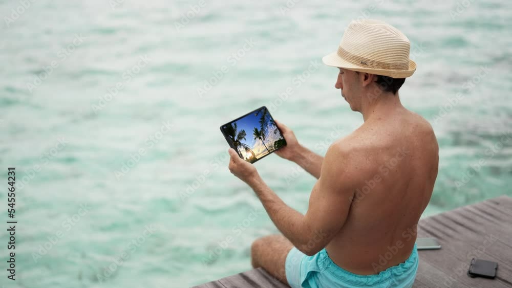 Poster watching video online on tablet computer