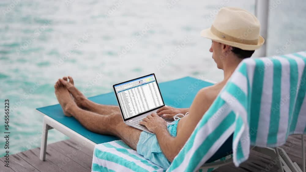 Leinwandbilder man using spreadsheet reports on laptop computer