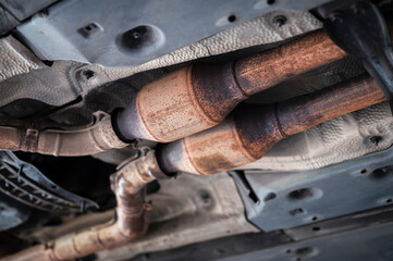 Close-up of catalytic converter in car exhaust system.