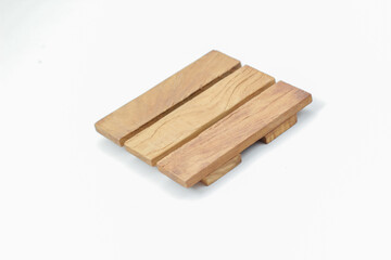 Square wooden placemat isolated on white background. Product photo properties.