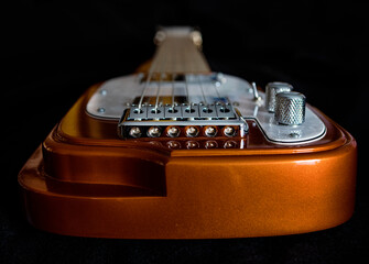 Electric Lap Steel guitar for blues, country, bluegrass music with black back ground