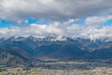 Landscape with cloud and snow covered mountains