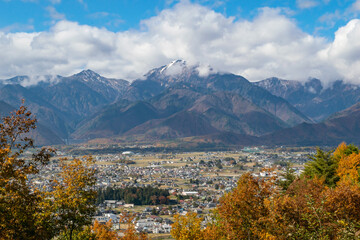 Landscape mountain with clouds and snow in autumn 