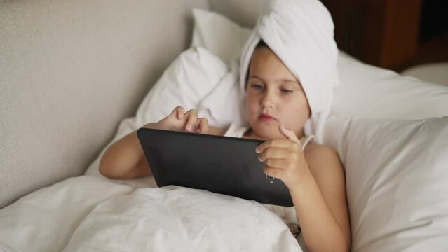 Child Using Tablet Watching Movie
