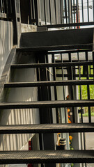 black stairs leading to the top floor made of iron, aesthetic theme