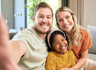 Fototapeta na wymiar Happy family, adoption and smile for selfie love, relax or bonding in happiness together at home. Mother, father and adopted child smiling or relaxing for photo moment or capture on living room couch