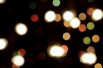 Obraz premium multicolored festive lights on a black background screensaver backdrop