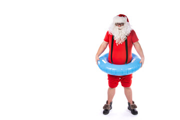 Vacation and holidays. Funny Santa Claus posing with an inflatable ring on a white background. Merry Christmas.