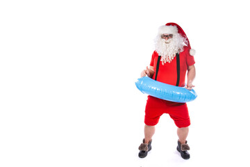 Vacation and holidays. Funny Santa Claus posing with an inflatable ring on a white background. Merry Christmas.