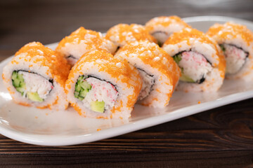 close up of sushi rolls on white dish. Sushi menu. Japanese