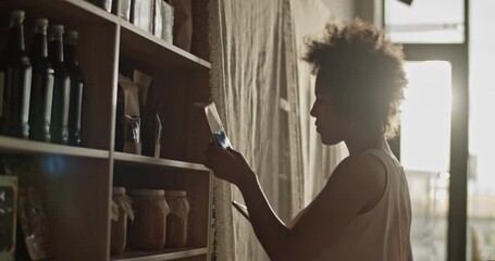 Shop employee packing products for online order